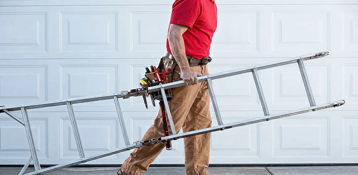 Garage door repair technician arriving with tools and ladder in Boise, ID